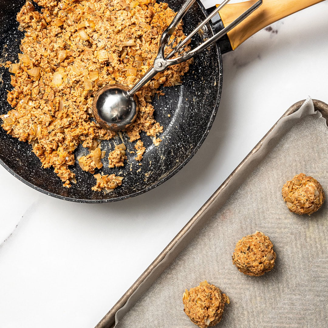 Vegan meatballs shaped with cookie dough scoop.