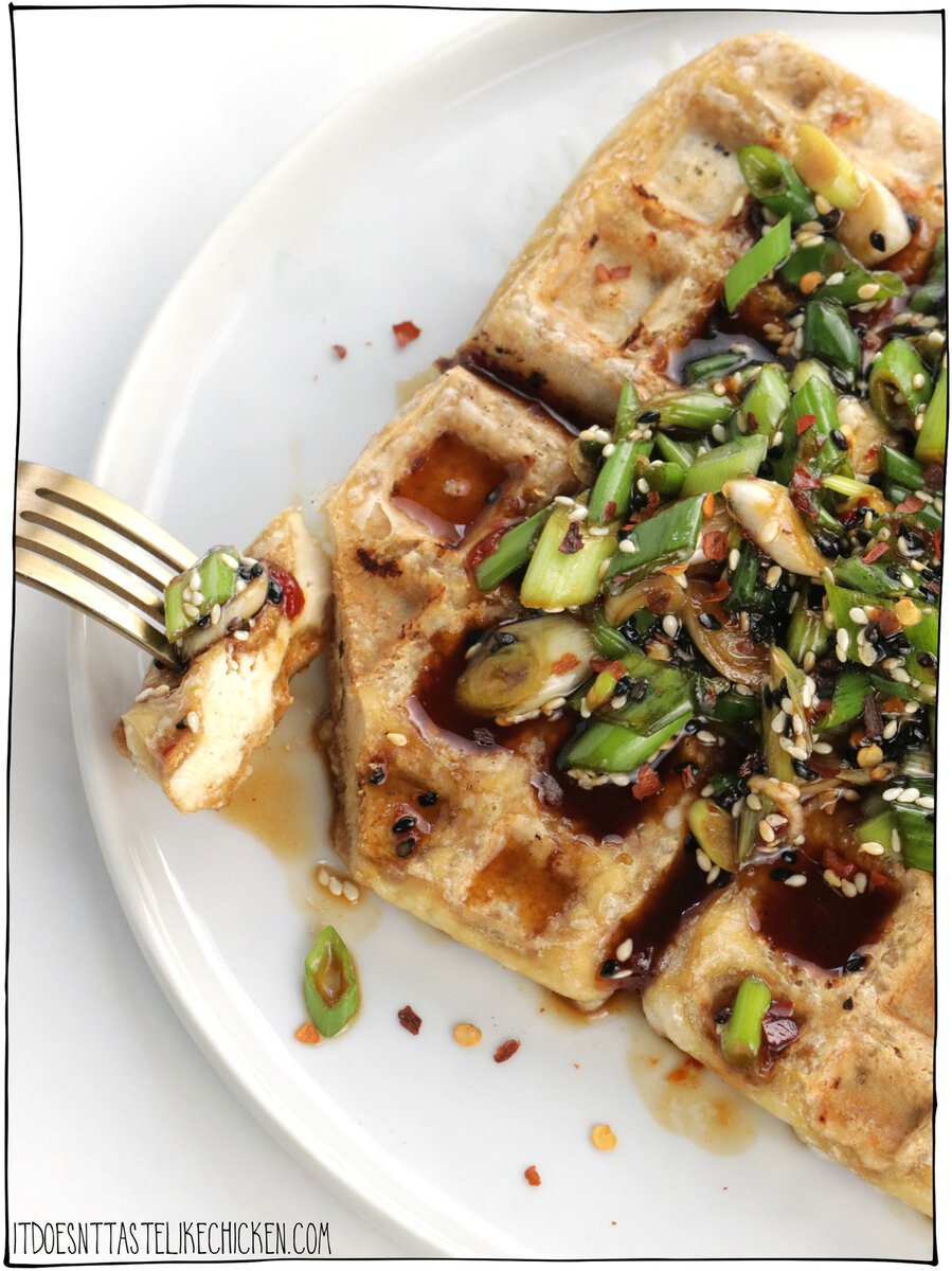 Use your waffle iron to make waffle tofu! It's crispy on the outside, tender in the middle, and makes a great vehicle for any toppings, sauces, or garnishes you like! It also makes a great high-protein substitute for toast. Quick and easy to make with just 3 ingredients! #itdoesnttastelikechicken #tofu #waffle
