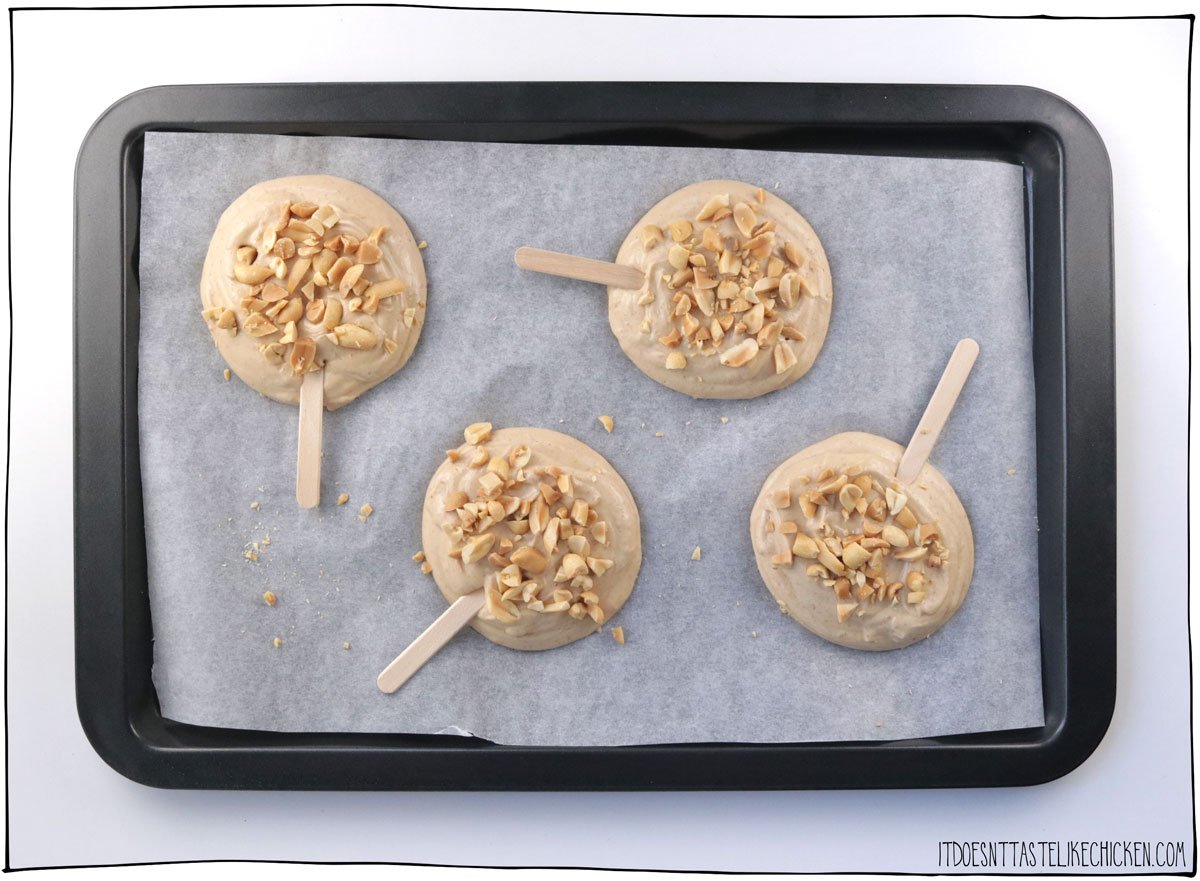 Dollop onto a parchment paper lined baking sheet and top with roasted peanuts, then freeze.