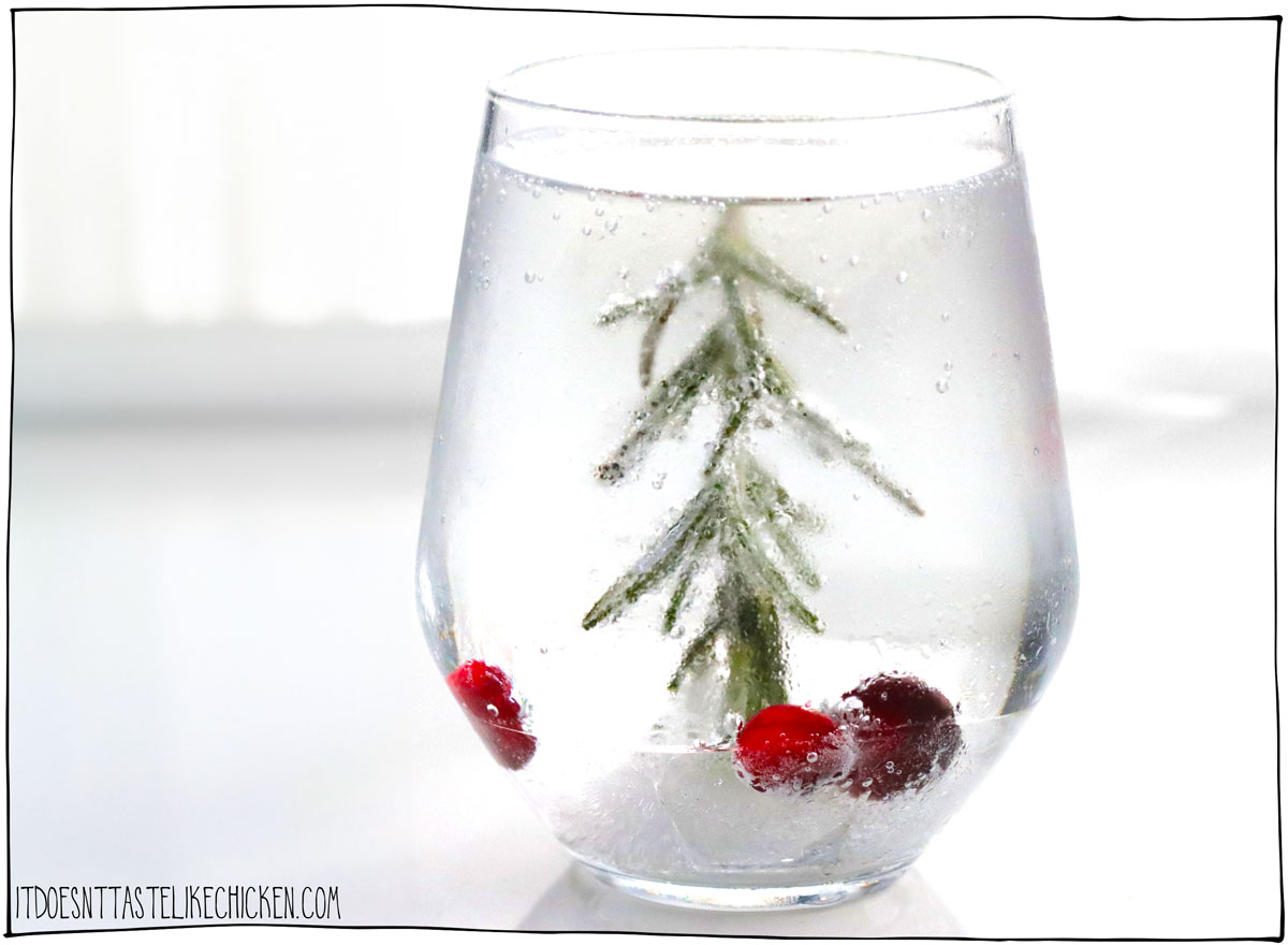 Celebrate the holidays with this festive Christmas Tree Drink! This recipe has options for both cocktails and mocktails so that everyone can have a drink. The Christmas "tree" is made from a sprig of rosemary that is frozen in ice, with cranberries or pomegranate seeds for decoration.
