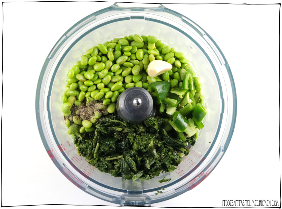 Add the edamame, spinach, olive oil, lemon juice, jalapeno, garlic, salt, and pepper to a food processor and blend. 