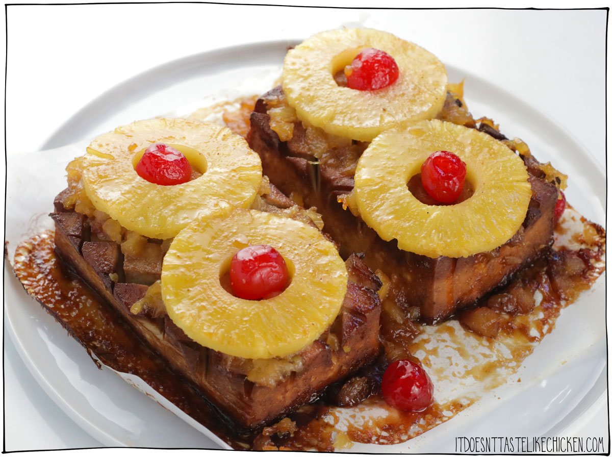 Get ready to steal the show at your next gathering with this Vegan Pineapple Glazed Ham – a playful take on the timeless favorite! Smoky tofu ham is baked in a sweet spiced pineapple glaze and decorated with pineapple rings and maraschino cherries for that retro look. With just 10 simple ingredients, this easy vegan ham recipe is a guaranteed hit, whether it's Easter, Christmas, or any occasion calling for a stunning centerpiece. 