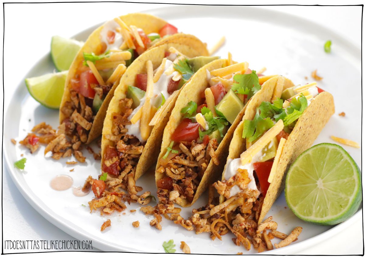 Get ready to fall in love with my new Easy Vegan Tacos made with Shredded Tofu Taco Meat! This is the BEST vegan taco meat you'll ever taste! The secret is to use a cheese grater to grate the tofu into shreds- this gives it a texture similar to pulled chicken! The tofu is then sautéd with onion, garlic, tomato, and a homemade spice blend for the best taco seasoning. Just 30 minutes to make, these shredded tofu vegan tacos are bursting with flavor in every bite. 🌮🥳