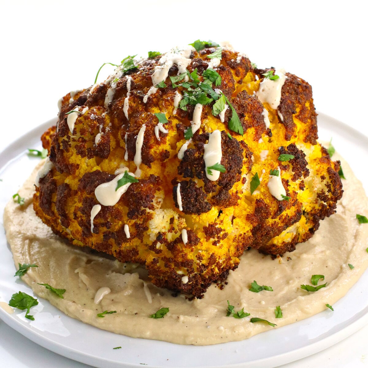 Whole Roasted Cauliflower with Tahini Sauce • It Doesn't Taste Like Chicken