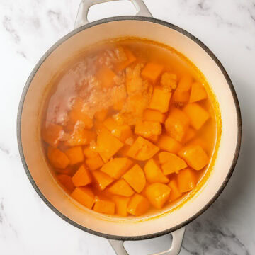 Sweet potatoes in pot of boiling water.