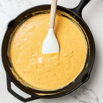 Vegan cheese sauce in skillet.