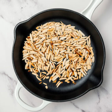 Toasted almonds in skillet.
