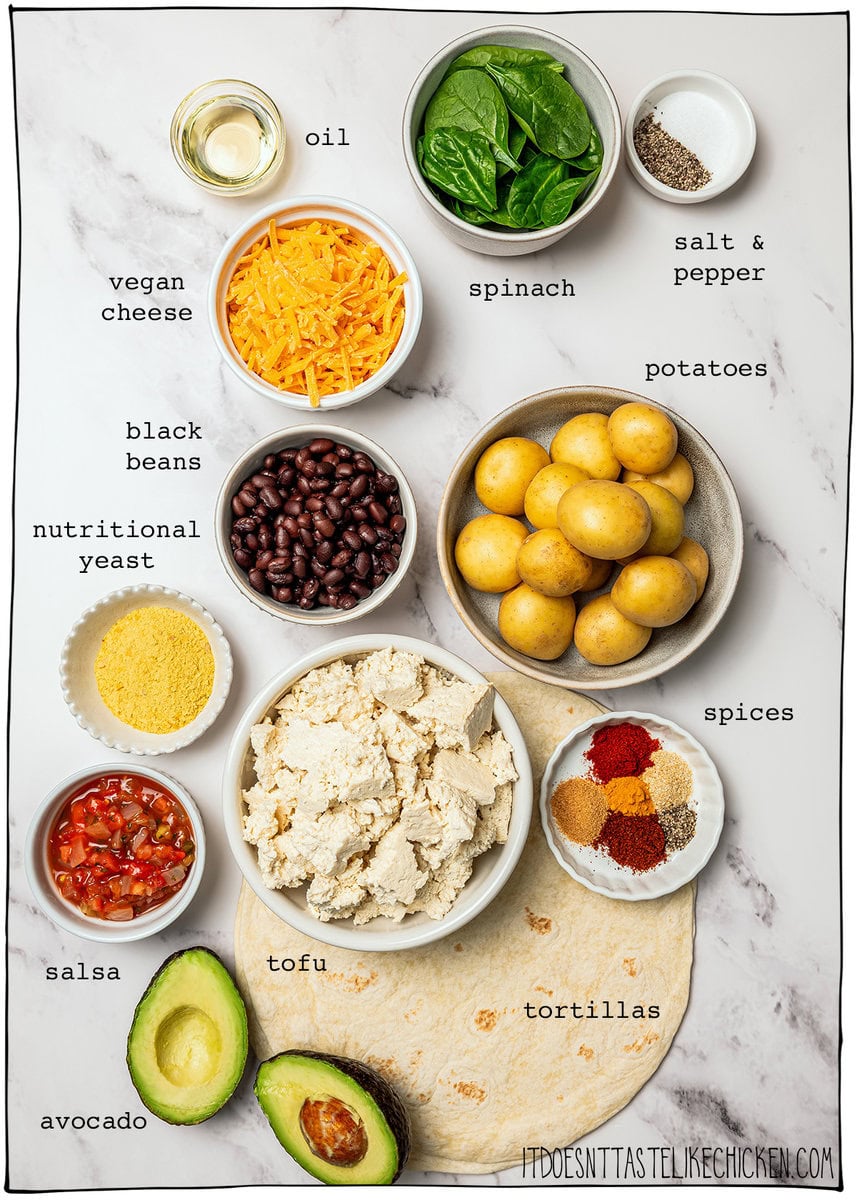 These freezer-friendly vegan breakfast burritos are packed with tofu scramble, crispy potatoes and cheese. Heat and eat for busy mornings! Ingredients for vegan breakfast burritos with labels.