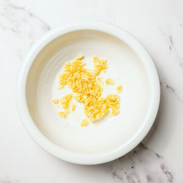 Mashed banana in bowl.