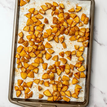 Roasted potatoes on sheet pan.