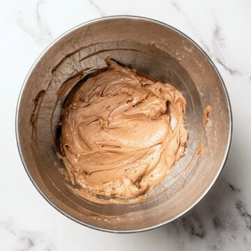 Vegan chocolate frosting in mixing bowl.