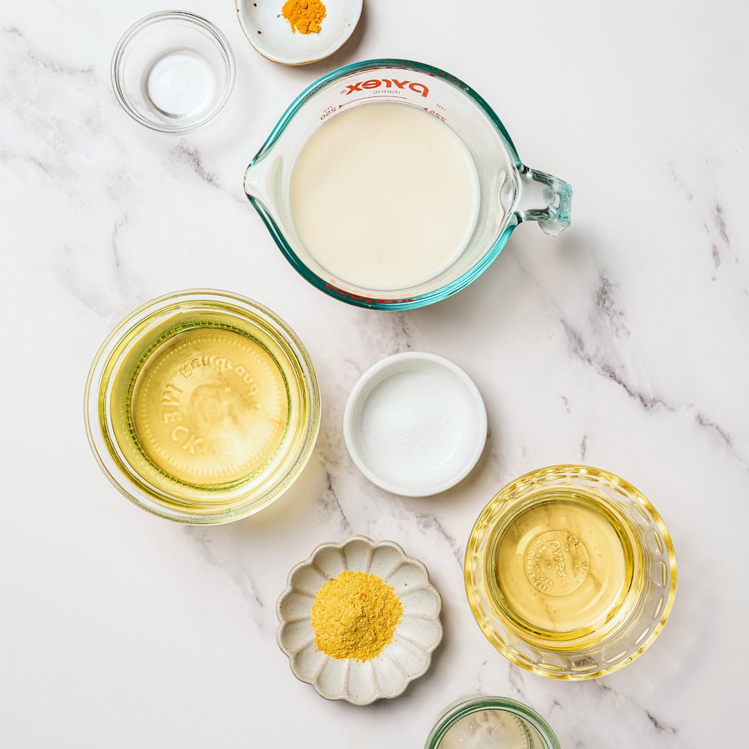 This homemade vegan butter melts, spreads and tastes like the real thing! Easy to make with everyday ingredients, you can even bake with it. Ingredients for homemade vegan butter.