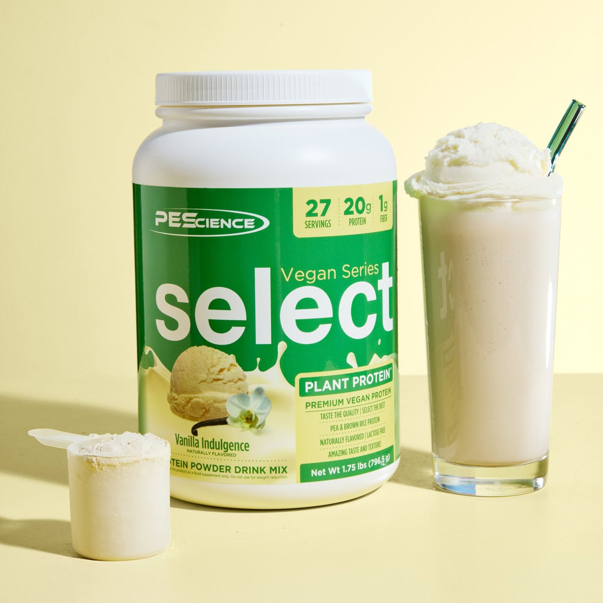 Tub of Vanilla Indulgence PEScience Select Vegan Protein Powder with shake beside it.