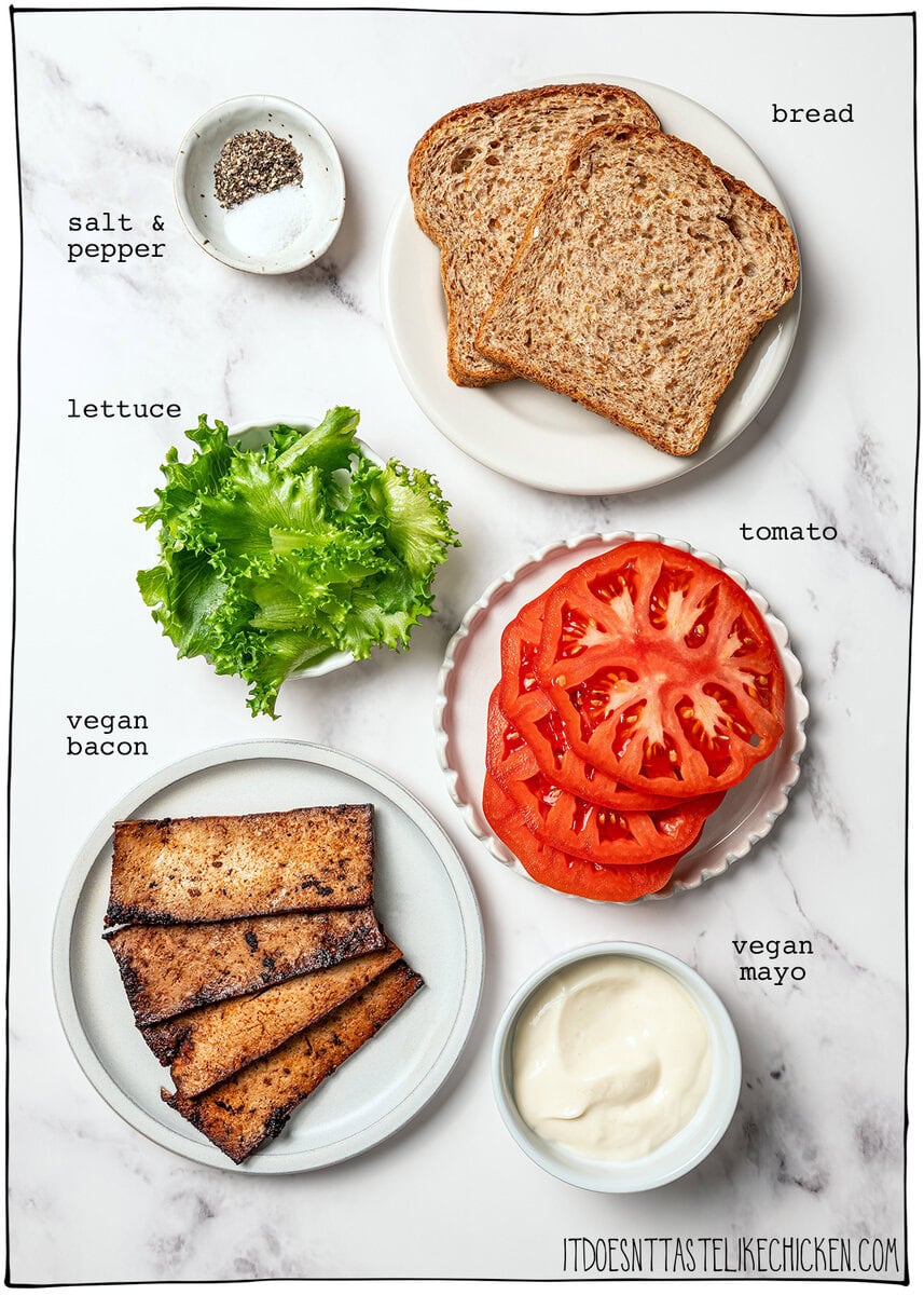 This vegan BLT is made with smoky plant-based bacon, juicy tomatoes, crisp lettuce, and creamy mayo. Easy, satisfying, and ready fast! Ingredients for vegan BLT sandwiches with labels.