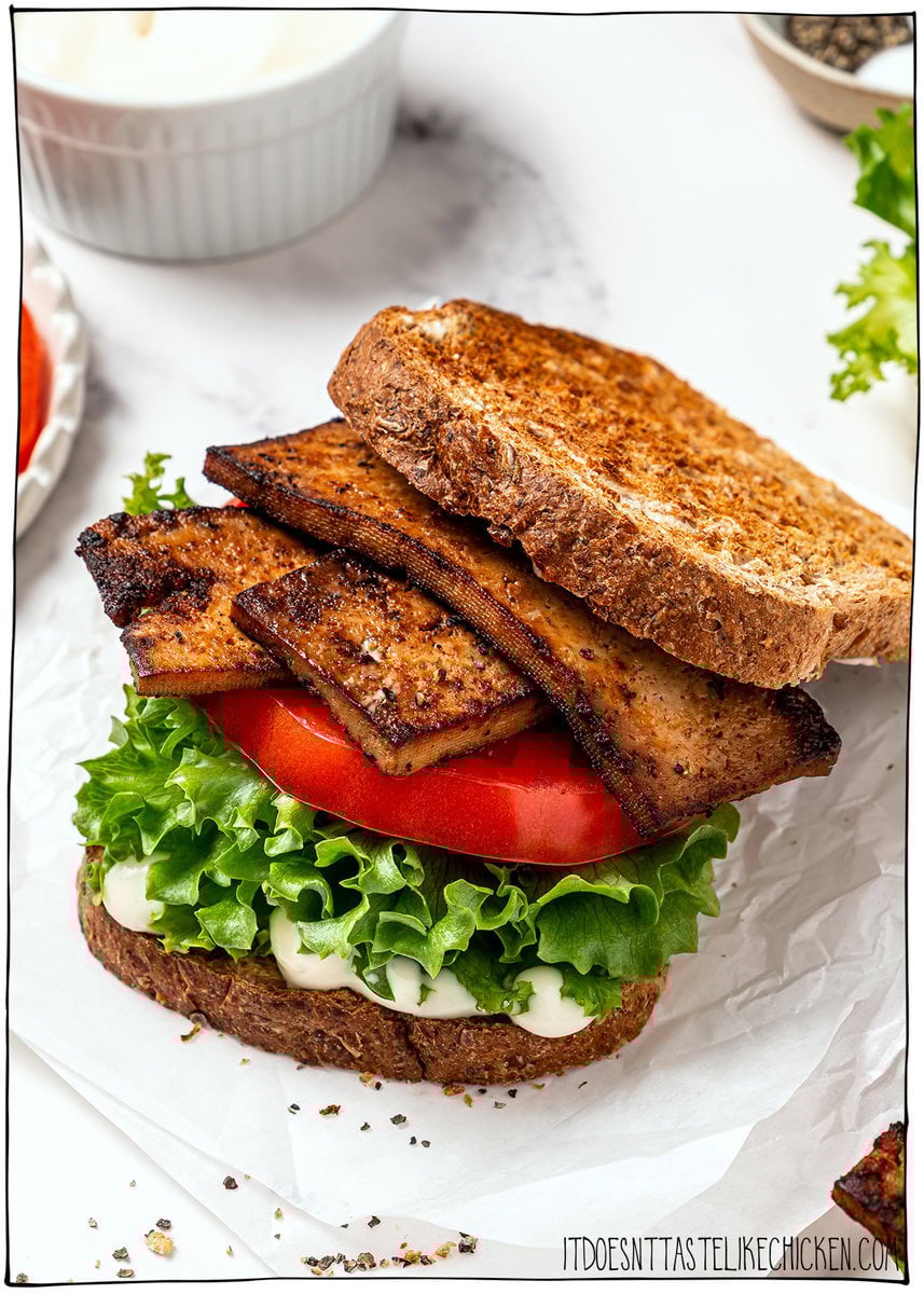 This vegan BLT is made with smoky plant-based bacon, juicy tomatoes, crisp lettuce, and creamy mayo. Easy, satisfying, and ready fast! Vegan BLT sandwich on toasted bread.
