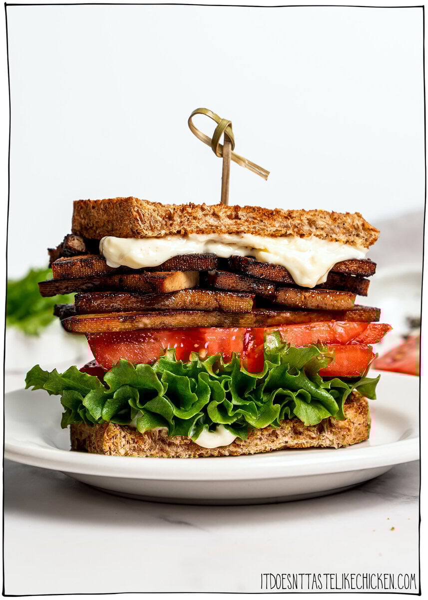 This vegan BLT is made with smoky plant-based bacon, juicy tomatoes, crisp lettuce, and creamy mayo. Easy, satisfying, and ready fast! Vegan BLT sandwich on plate.