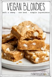 Vegan blondies stacked on plate.