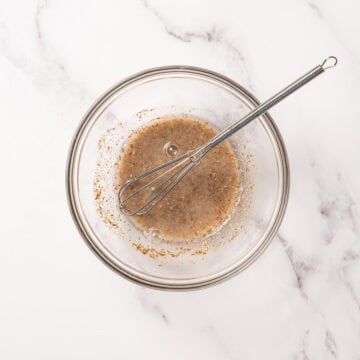 Flax egg in bowl with whisk.