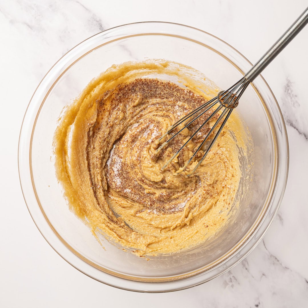 These soft, chewy vegan blondies have rich caramel flavor for bakery-style vibes. An easy one bowl recipe made egg-free and dairy-free! Whisking wet ingredients for blondies.