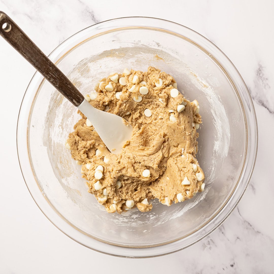 These soft, chewy vegan blondies have rich caramel flavor for bakery-style vibes. An easy one bowl recipe made egg-free and dairy-free! Blondie batter in bowl with rubber spatula.