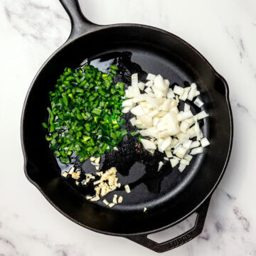 Onion, garlic, and poblano in skillet.