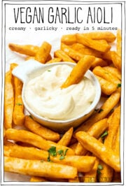 Fries and bowl of aioli with text overlay that reads vegan garlic aioli.