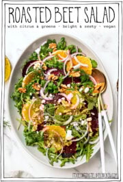 Salad on serving platter with text overlay that reads "roasted beet salad."