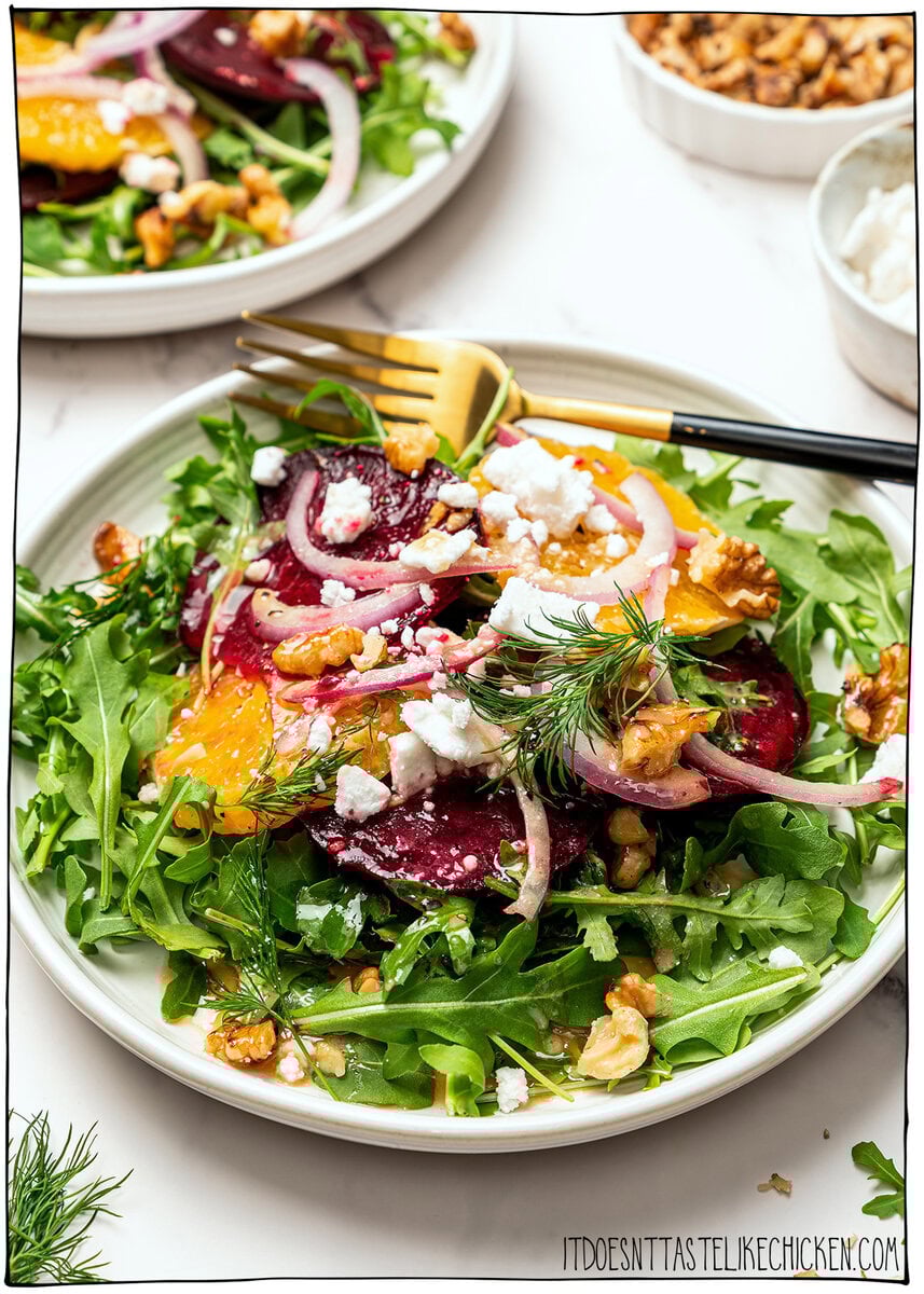 This roasted beet salad is fresh, vibrant and flavorful, with sweet roasted beets, juicy oranges and a tangy dressing. Elegant yet simple! Plate of roasted beet salad with fork.