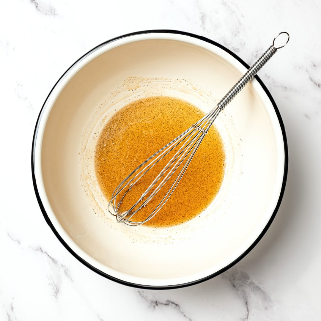 This pistachio cardamom granola is lightly sweet, perfectly crunchy, and infused with warm, aromatic cardamom. Easy 30 minute recipe! Whisk in bowl of wet ingredients for granola.