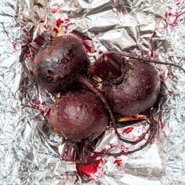Roasted beets on sheet of foil.