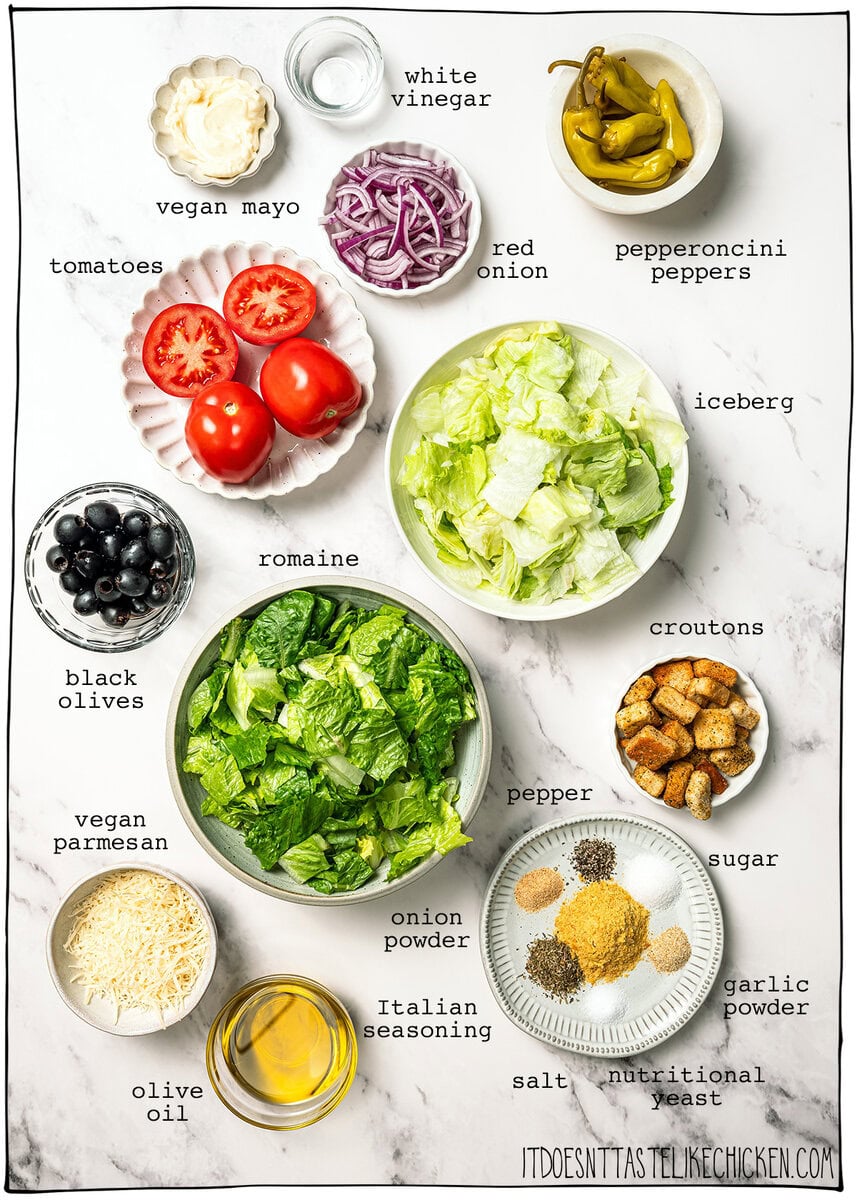 This vegan Olive Garden salad tastes just like the classic, with crisp lettuce, juicy tomatoes, olives and creamy, tangy Italian dressing! Ingredients for Olive Garden salad.