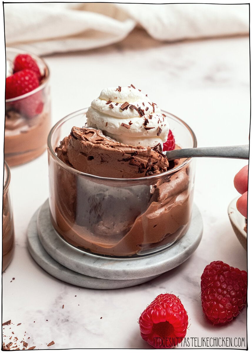 This Silken Tofu Chocolate Mousse is rich, silky, deeply chocolatey, and you’d never guess it’s made with tofu. Whips up in minutes! Spoonful of tofu chocolate mousse in glass cup.
