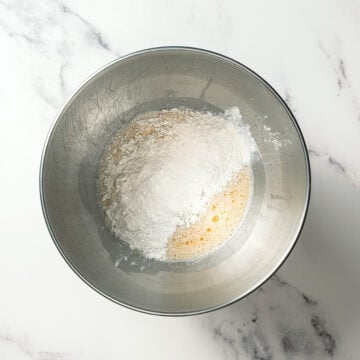 Flour added to wet ingredients for vegan Olive Garden breadsticks.