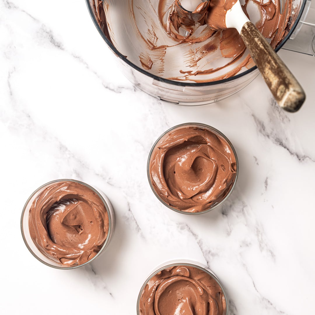 This Silken Tofu Chocolate Mousse is rich, silky, deeply chocolatey, and you'd never guess it's made with tofu. Whips up in minutes! Tofu chocolate mousse spooned into 3 cups.
