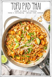 Skillet of noodles with text overlay that reads tofu pad thai.