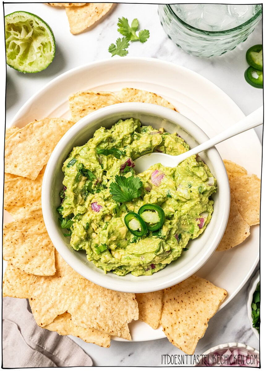 This easy Chipotle guacamole recipe is creamy, bright, and packed with fresh flavor, just like the restaurant version. Only 5 ingredients! Bowl of Chipotle guacamole with chips.