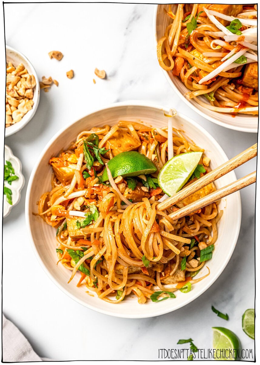 Pad thai noodles wound around chopsticks.