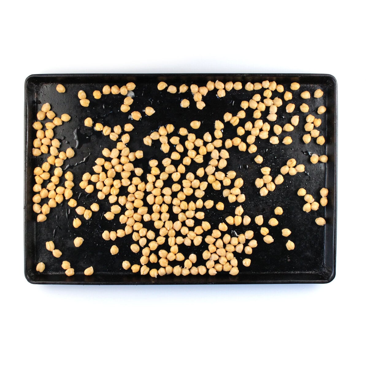 Baking sheet with chickpeas spread out