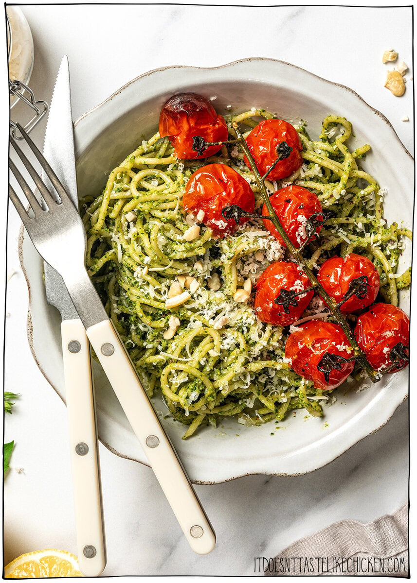 This creamy vegan pesto is rich, vibrant, and packed with fresh basil flavor, just like classic pesto, but completely dairy-free! Pasta with vegan pesto and roasted cherry tomatoes.