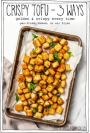 Sheet pan of tofu with text overlay that reads crispy tofu 3 ways.