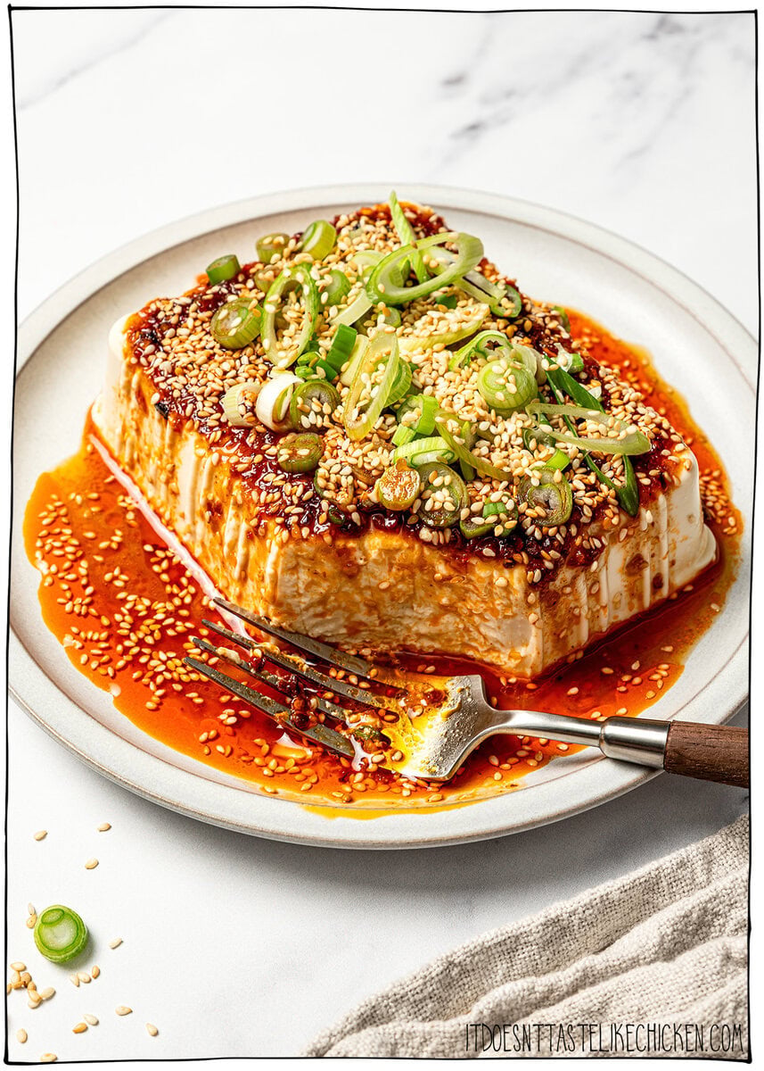 Fork on plate with chili crisp tofu.