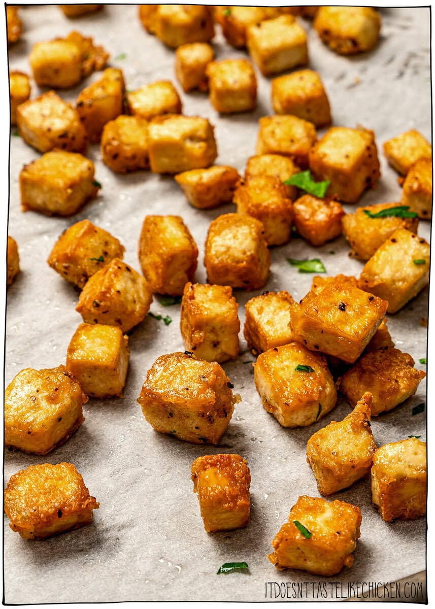 Whether you pan-fry, bake, or use an air fryer, this easy crispy tofu recipe turns out golden, flavorful, and delicious every single time! Pan of golden brown crispy tofu.