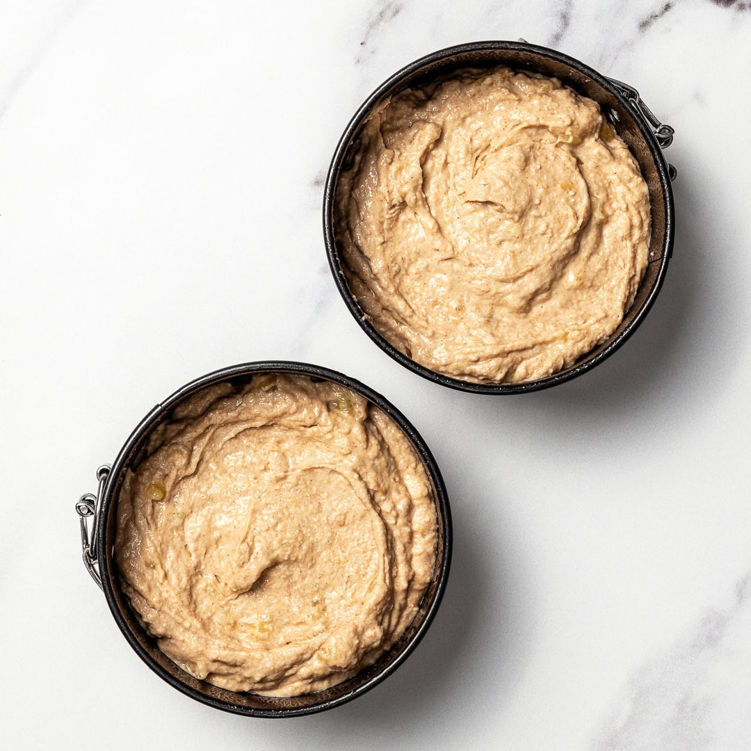 This easy dog birthday cake recipe is soft, simple and made with wholesome, dog-friendly ingredients like banana, oats and peanut butter! Unbaked dog birthday cake layers in springform pans.