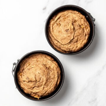 Two dog birthday cake layers in springform pans.