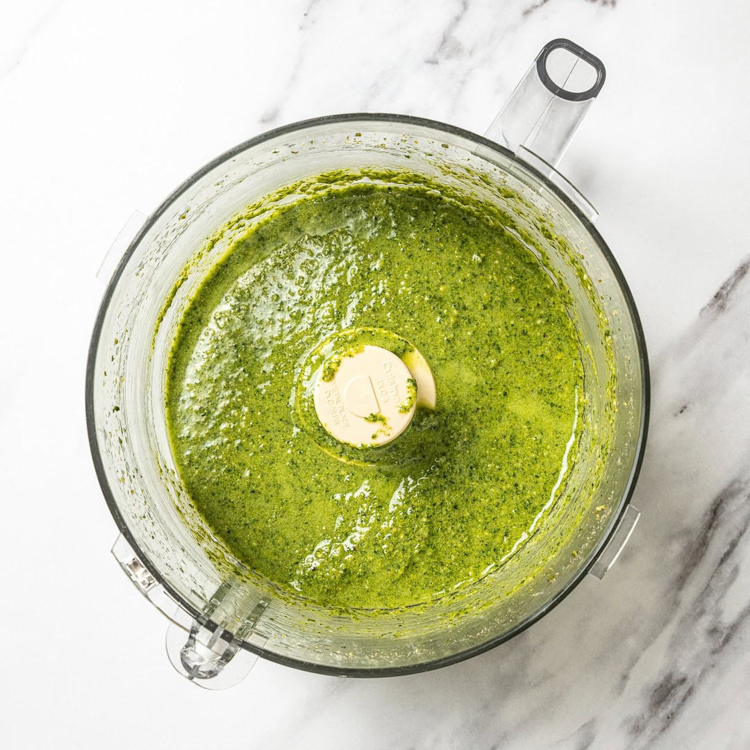 This creamy vegan pesto is rich, vibrant, and packed with fresh basil flavor, just like classic pesto, but completely dairy-free! Pesto blended in food processor.