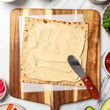 Hummus spread onto lavash.