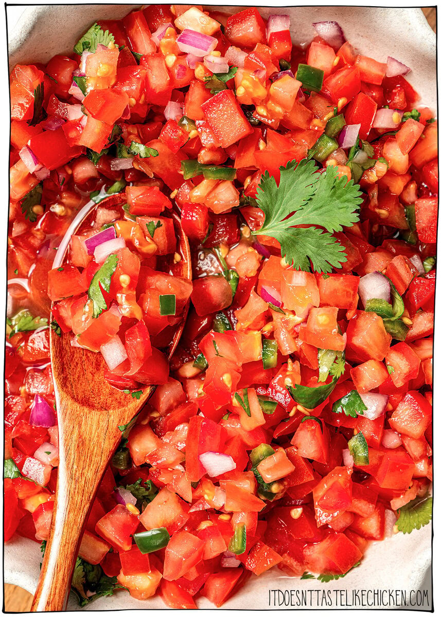 This pico de gallo tastes just like Chipotle's, but even better because it’s extra fresh, easy to customize, and made at home in minutes! Fresh pico de gallo in bowl.