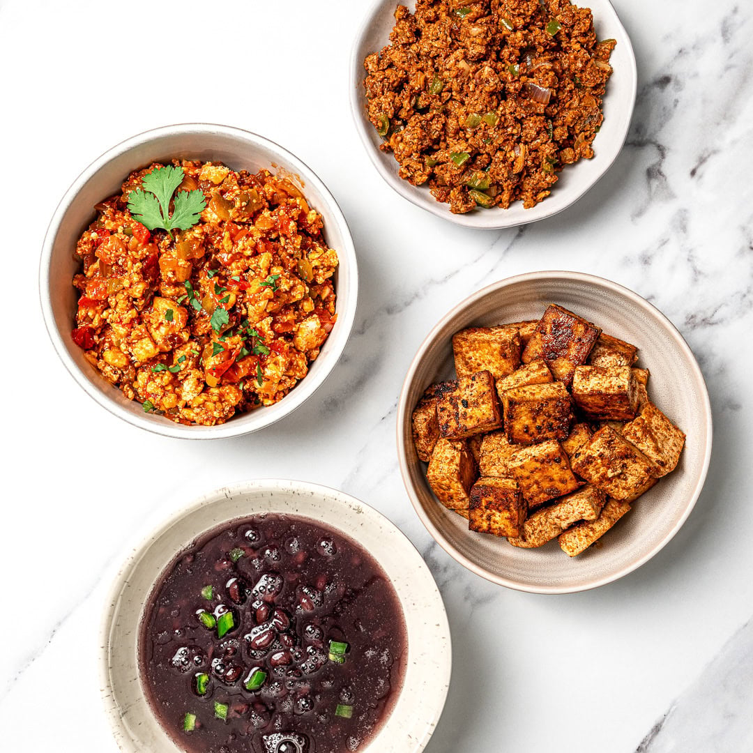 A guide to building your own burrito bowl with rice, protein, veggies, salsa, and creamy toppings for an easy and satisfying vegan meal.