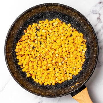 Charring corn in skillet.