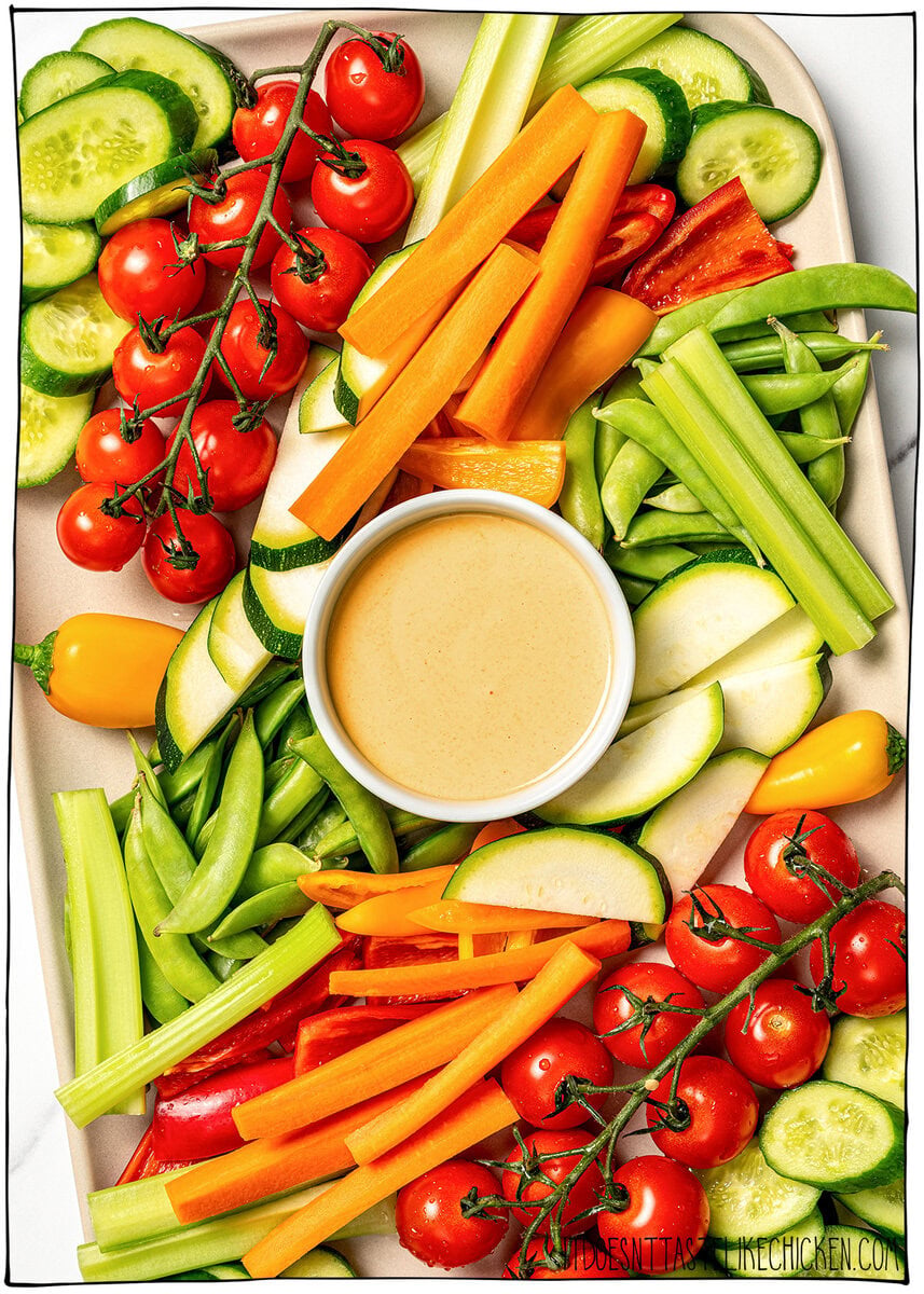 This homemade Vegan Honey Mustard Sauce is creamy, tangy, sweet, and ready in just 5 minutes, perfect for dipping ALL the things! Platter of vegetables with bowl of honey mustard sauce.